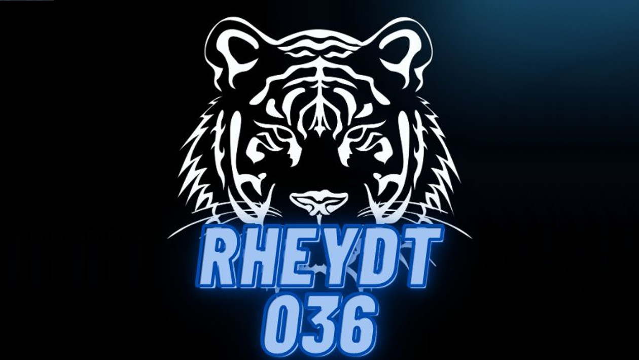 Eine Grafik eines Tigerkopfes in weiß auf schwarzem grund, darunter steht in blauer Schrift "Rheydt 036"